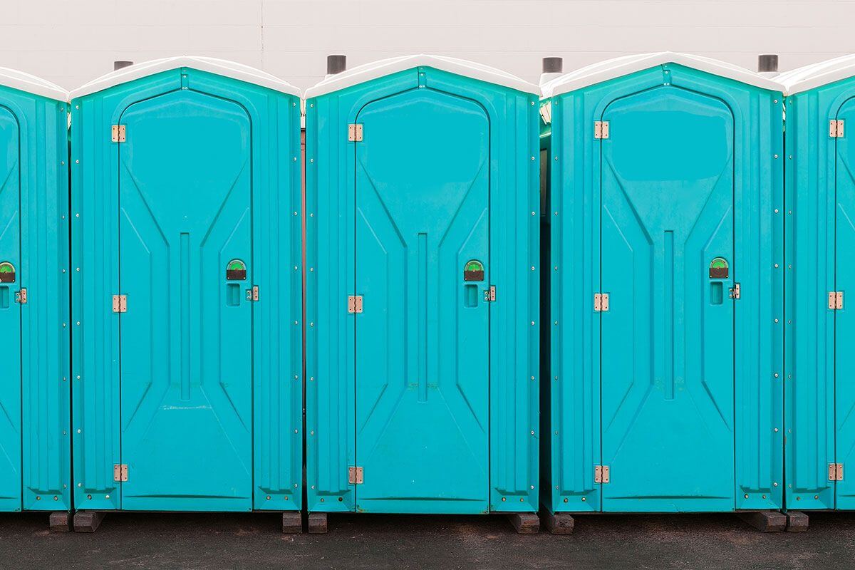 Industrial portable restroom units at a plant in Bangor, Maine